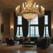 Luxurious hotel lobby with chandelier and plush seating.